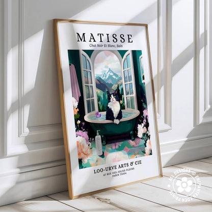 The image is a framed poster featuring an illustration of a cat sitting in a bathtub, surrounded by flowers and a scenic landscape.
