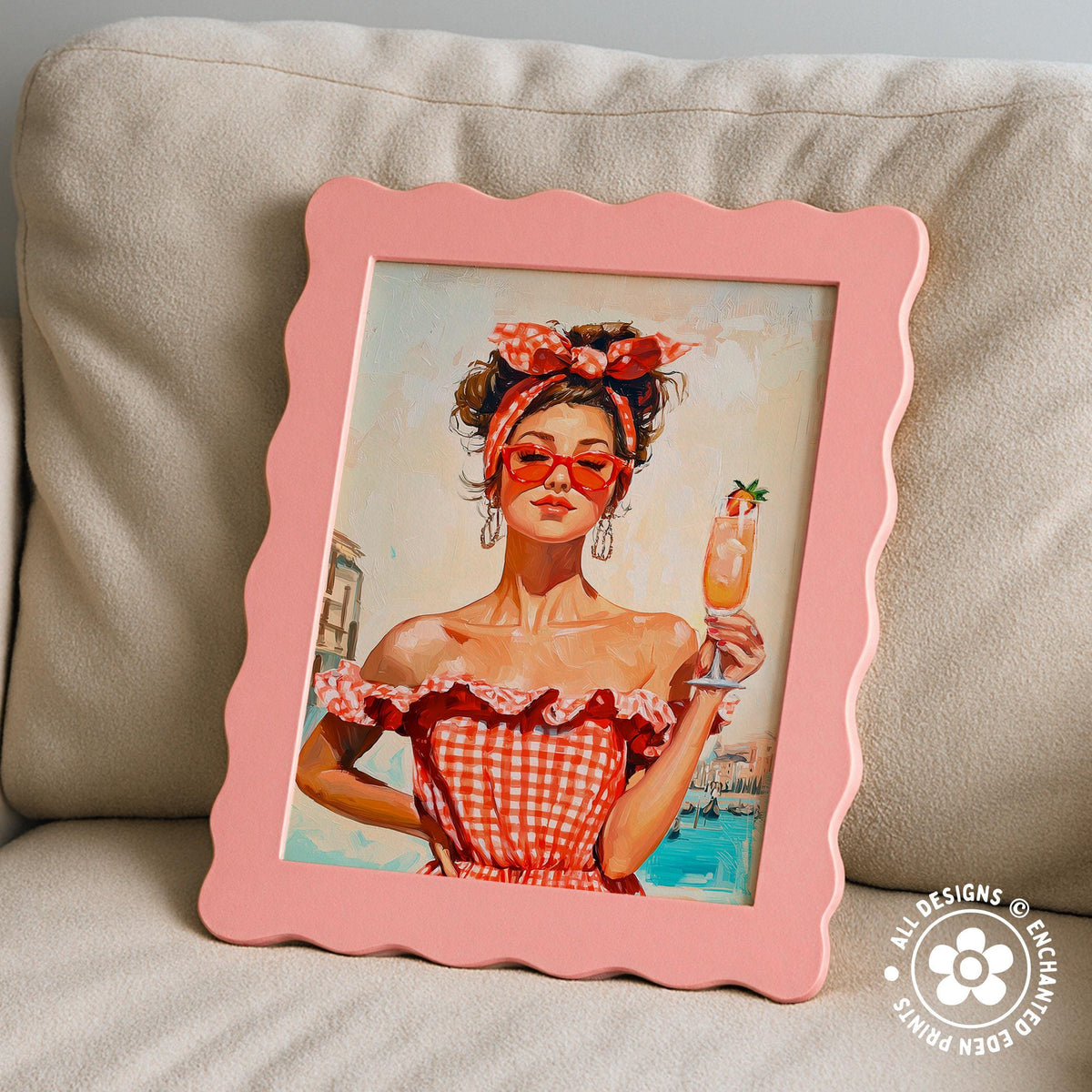 A framed painting of a woman in a red and white checkered dress holding a drink, with a pink frame and a scalloped edge.