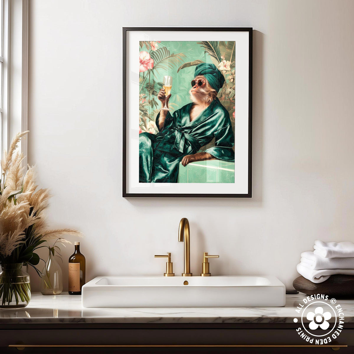 a framed painting of a monkey dressed in a green robe and holding a drink, sitting on a bench in a tropical setting. The painting is hung on a wall above a white sink with a gold faucet.