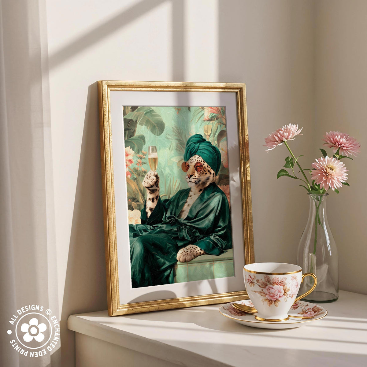 a framed painting of a leopard wearing a green robe and holding a glass of champagne, with pink flowers in a vase to the right.