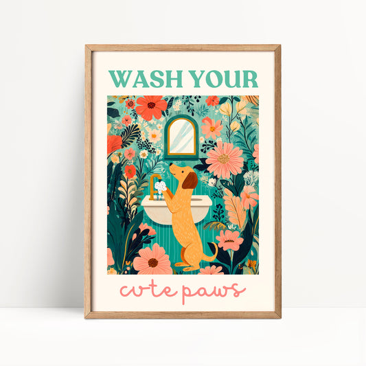 The image is a framed poster with a dog standing in front of a sink, surrounded by flowers and plants. The poster has a floral and nature-inspired design, with the text "WASH YOUR cute paws" written at the bottom.