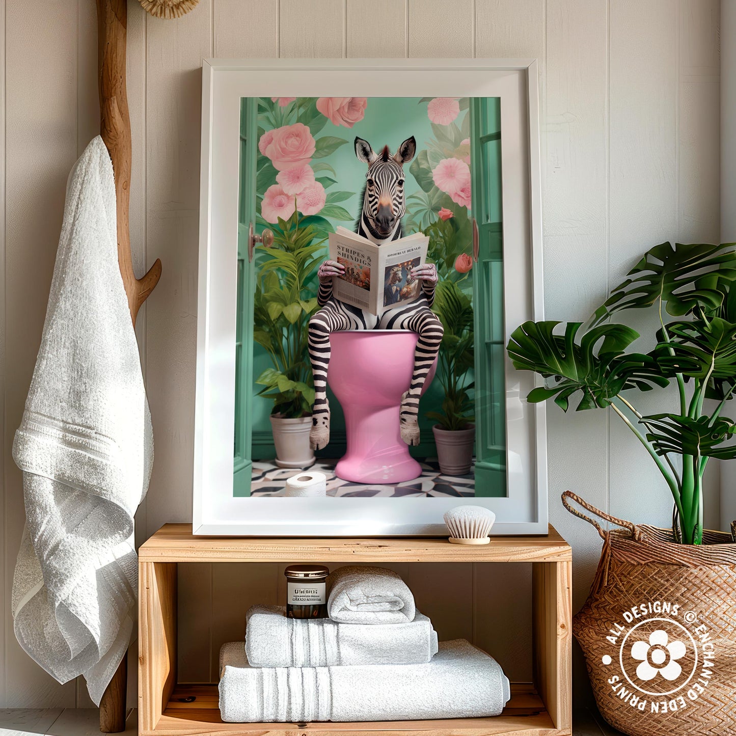 A framed image of a zebra sitting on a pink toilet, surrounded by pink flowers and green plants, in a bathroom setting with a wooden shelf and a woven basket.