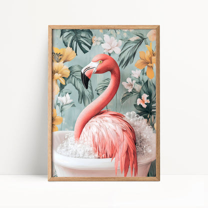 A framed print depicting a pink flamingo sitting in a white bathtub filled with bubbles, surrounded by a tropical floral background.