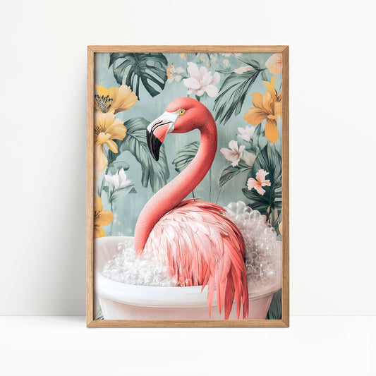 A framed print depicting a pink flamingo sitting in a white bathtub filled with bubbles, surrounded by a tropical floral background.