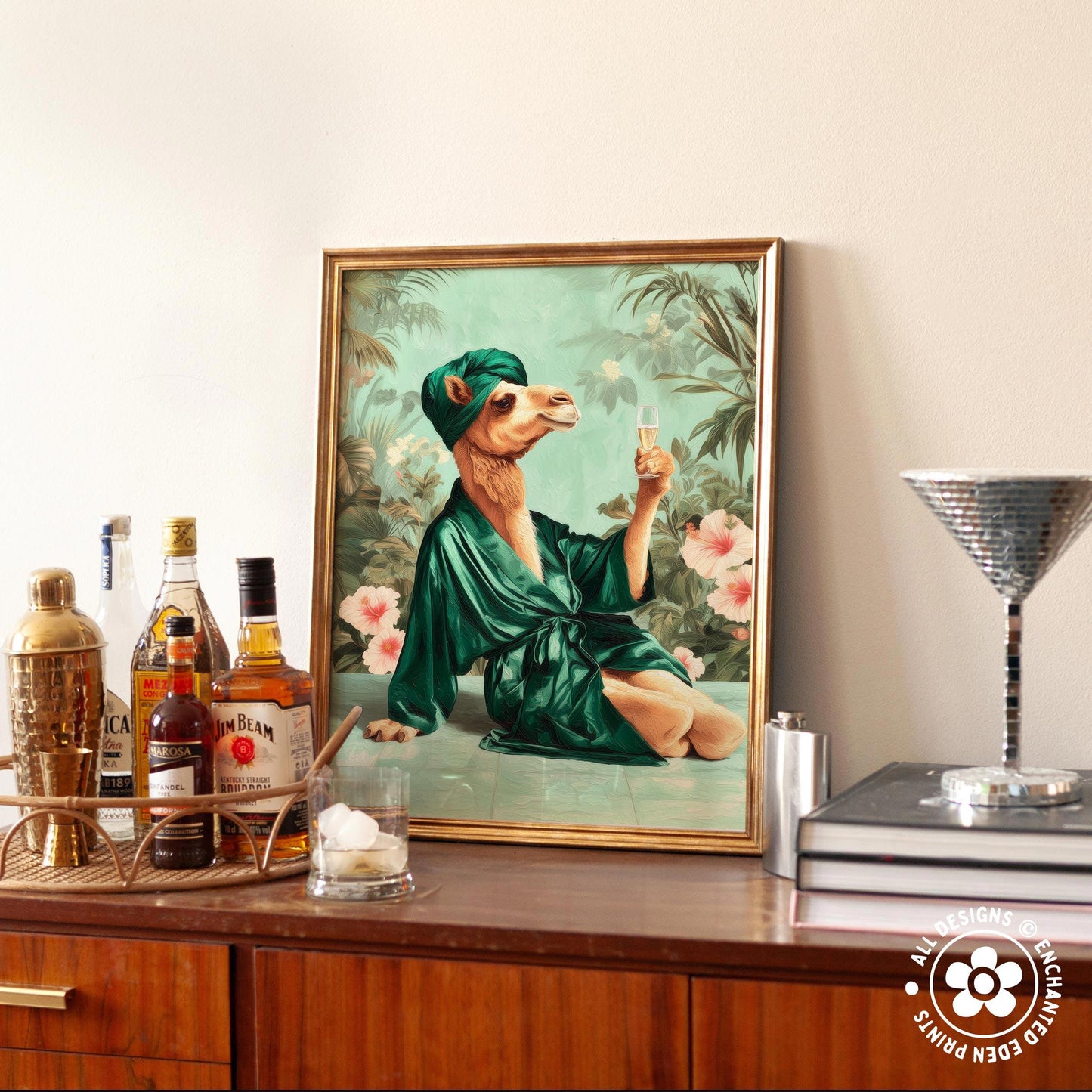 a framed painting of a camel wearing a green robe and holding a glass of wine, surrounded by various bottles of alcohol and a cocktail shaker on a wooden surface.