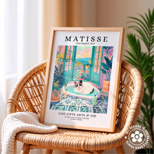A framed print of a colorful painting depicting a cat sitting on a windowsill, with a tropical garden scene in the background.